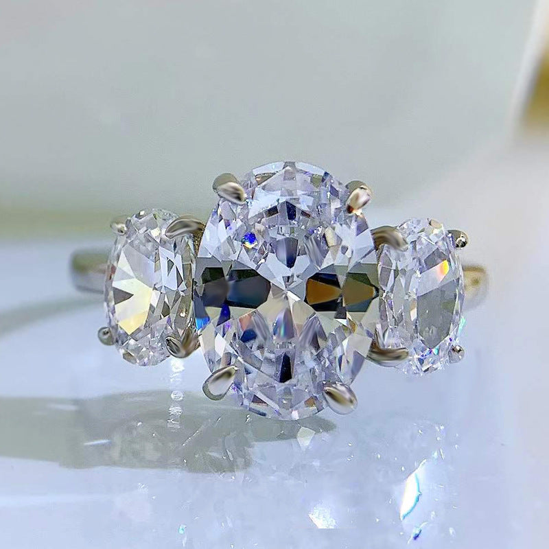 Urqanyu S925 silver oval four-claw support diamond three cubic zirconia engagement ring 8*11