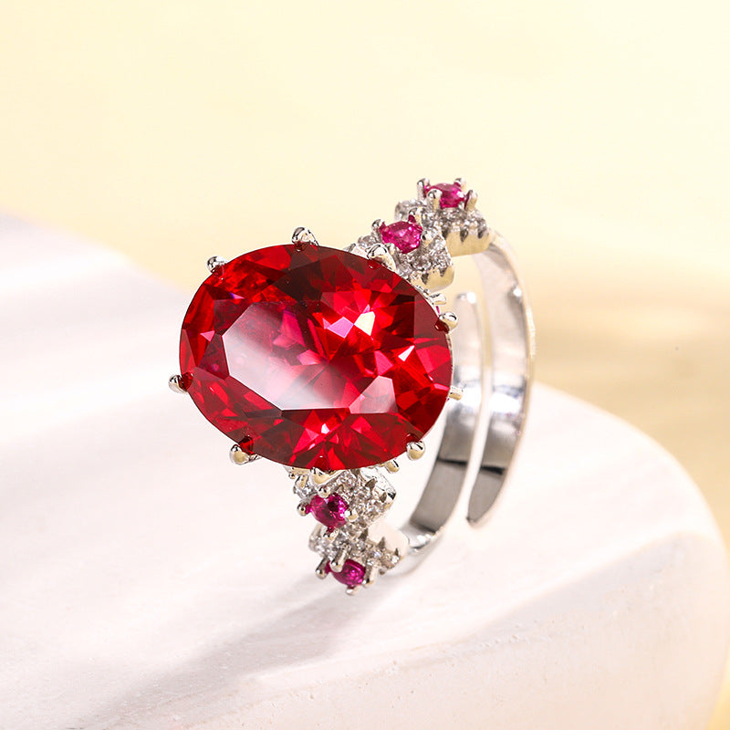 Urqanyu copper base gold-plated simulated colored gem corundum egg-shaped jump color creative cubic zirconia ring