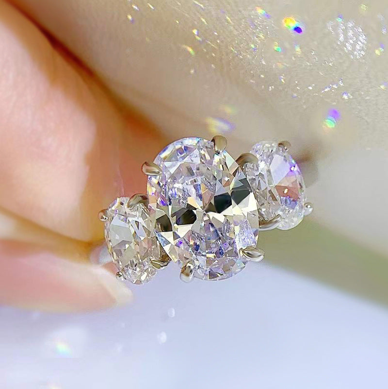 Urqanyu S925 silver oval four-claw support diamond three cubic zirconia engagement ring 8*11