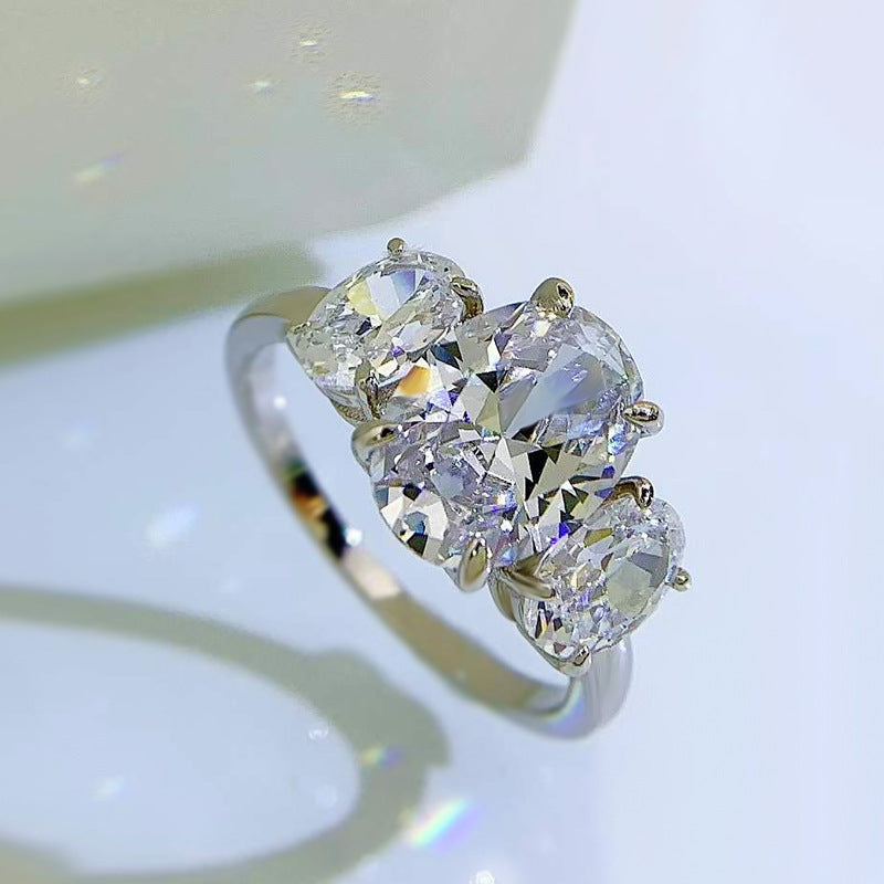 Urqanyu S925 silver oval four-claw support diamond three cubic zirconia engagement ring 8*11