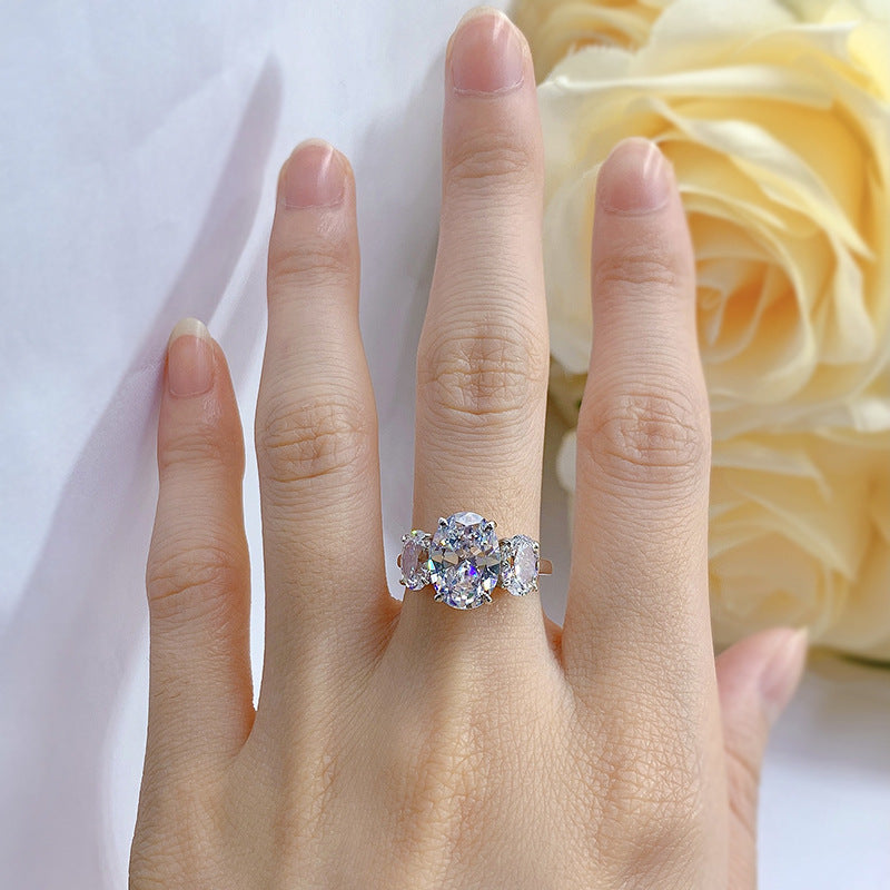 Urqanyu S925 silver oval four-claw support diamond three cubic zirconia engagement ring 8*11
